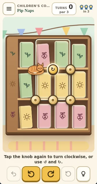 Actual Book Nook Shuffle bookcase on a phone: puzzle 22 in the Children’s Corner, with Biscuit the cat curled up on one knob, another knob picked, bunting across the wall and the turn buttons below.