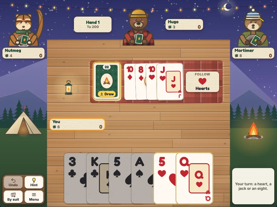 Actual Ember Ridge Crazy Eights gameplay on a desktop browser: a plank camp table at dusk under string lights, with Nutmeg the chipmunk at the upper left and Mortimer the marmot at the upper right, each above a name plate, and Hugo the bear at the top with his name plate beside him and the hand sign (hand 1, to 200) on his other side; the friends hold face-down cards, and their plates show 4, 3 and 8 cards left; on the plaid blanket in the middle, the stock of 22 cards marked Draw, the discard pile fanned with the jack of hearts on top, and a badge reading Follow Hearts; below, your name plate and your six cards, with the 5 and queen of hearts outlined and the 3 and king of clubs and the 5 and ace of spades dimmed; Undo, Hint, By suit and Menu on a wooden board at the lower left beside the tent, and the message asking for a heart, a jack or an eight at the lower right beside the campfire.