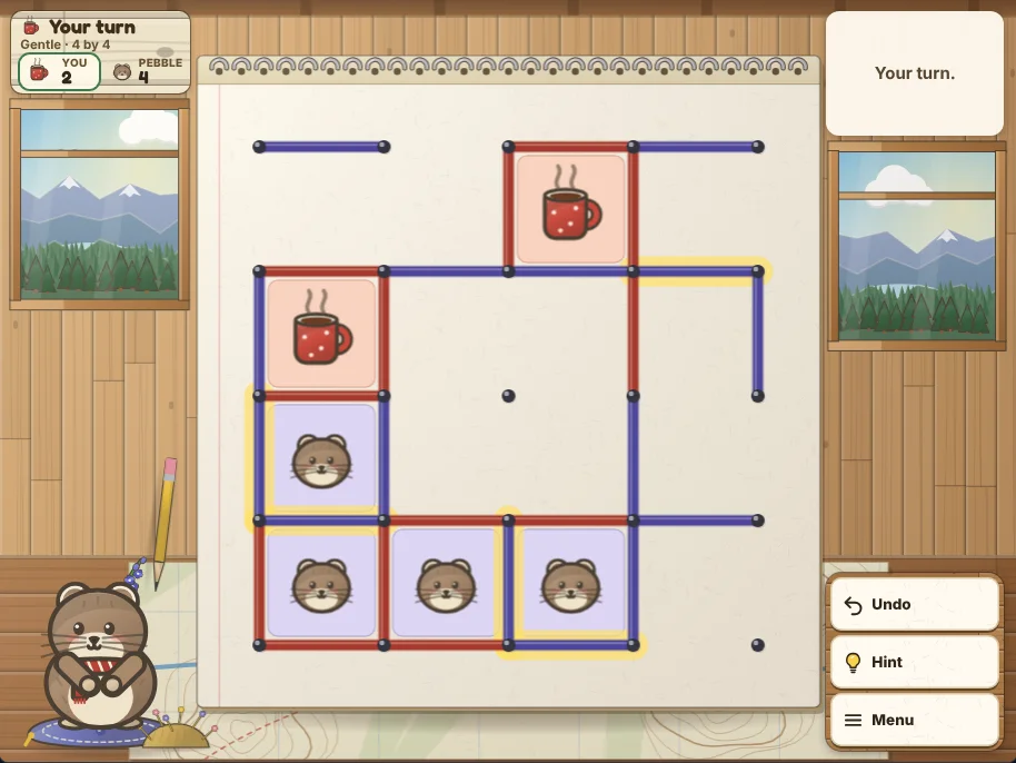 Actual Larkspur Lookout Dots and Boxes gameplay on a desktop browser: the spiral notepad in the middle of the lookout’s map table with a game in progress on the 4 by 4 board, lines in red and indigo pencil, boxes filled with red camp mugs and with Pebble’s face, the last turn under a yellow highlighter, the scoreboard sign and Pebble the pika on her cushion at the left, and Undo, Hint and Menu on the right.